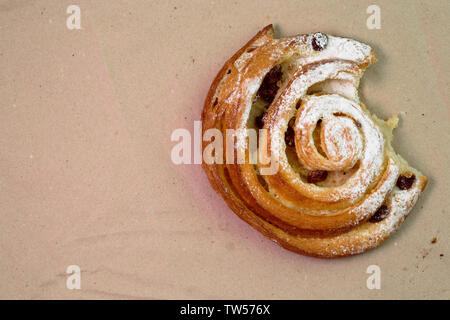 Buns with raisins on wood texture background. Stock Photo