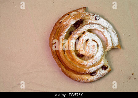 Buns with raisins on wood texture background. Stock Photo