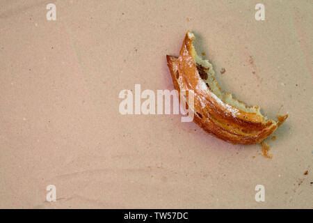 Piece of muffin with raisins on wood texture background. Stock Photo