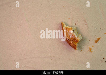 Piece of muffin with raisins on wood texture background. Stock Photo