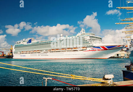 Bridgetown, Barbados - December 12, 2015: Azura cruise ship docked in sea port. P O Cruises. Transportation. Travelling by sea. Recreation and summer vacation. Stock Photo