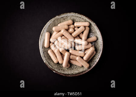 Cat's Claw (Uncaria tomentosa)  Extract Capsules. A Dietary Supplement. Stock Photo