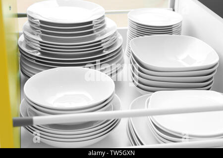 Plates in kitchen drawer Stock Photo