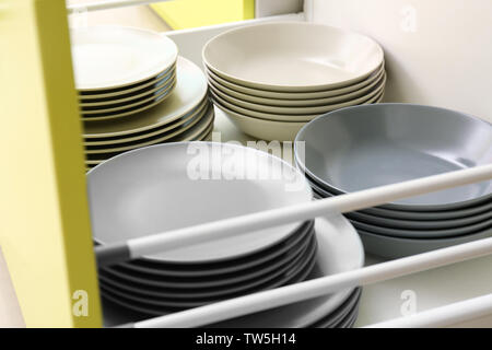 Plates in kitchen drawer Stock Photo