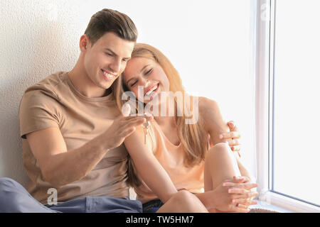 Young couple in their new house Stock Photo