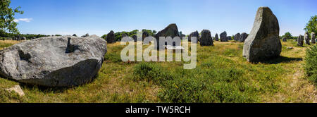 View of the standing stones, menhirs, in the village of Carnac, Brittany, France. Megalithic landmark Stock Photo
