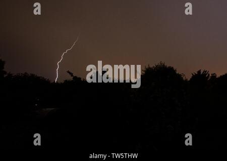 18th Jun 2019. UK weather.  Bolts of lightning appear over Sussex this evening as thunder storms spread Northwards from the channel.  East Sussex,UK.Credit: Ed Brown/Alamy Live News