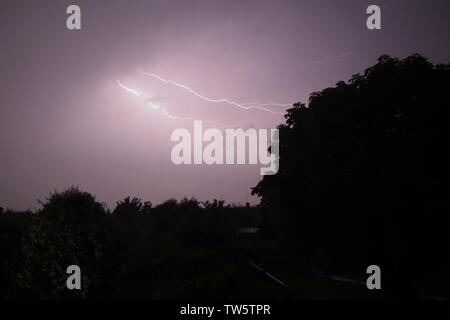 18th Jun 2019. UK weather.  Bolts of lightning appear over Sussex this evening as thunder storms spread Northwards from the channel.  East Sussex,UK.Credit: Ed Brown/Alamy Live News