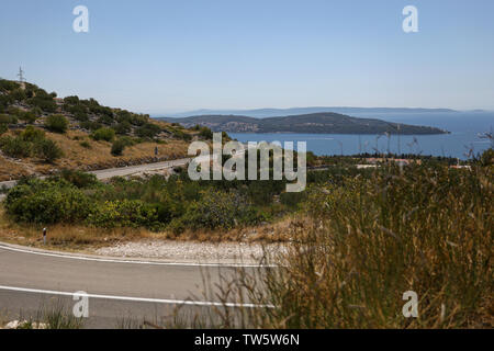 Bending automobile road in the hills of Croatia Stock Photo