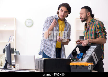 IT engineers working on hardware issue Stock Photo