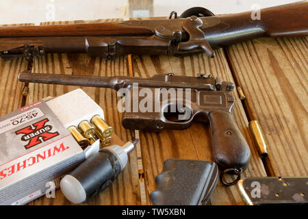 Mauser C96 Handgun and 45-70 Model 1873 Trapdoor Rifle Stock Photo