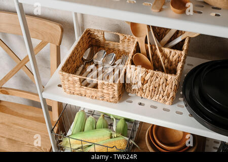 https://l450v.alamy.com/450v/tw624r/utensils-in-baskets-on-storage-stand-indoors-tw624r.jpg