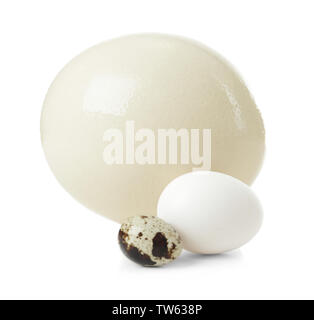 Ostrich, chicken and quail eggs on white background Stock Photo