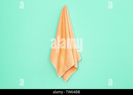 Apricot towel on trendy color background Stock Photo