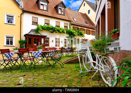Narrow street in the old town of Amorbach in Lower Franconia, Bavaria, Germany Stock Photo