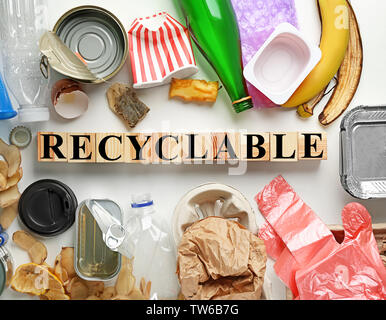 Composition with garbage and word Recyclable on white background Stock Photo