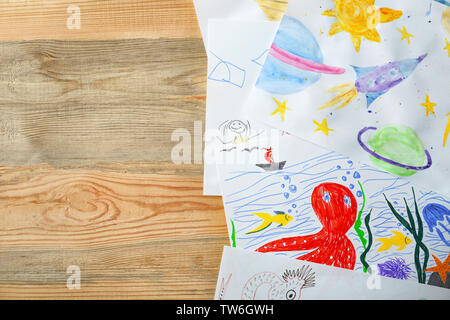 Children's drawings on wooden background Stock Photo