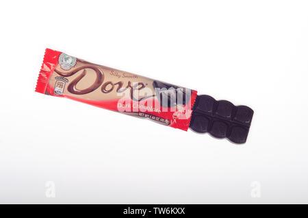 Dove dark chocolate candy bar by Mars, Inc. with wrapper opened Stock Photo