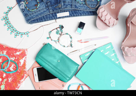Composition with clothes and accessories on light background Stock Photo