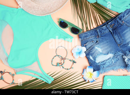 Composition with mint clothes and accessories on apricot background Stock Photo