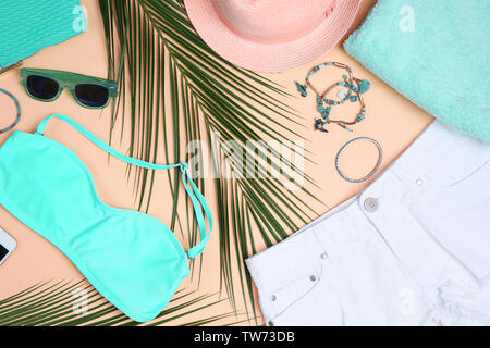 Composition with mint clothes and accessories on apricot background Stock Photo