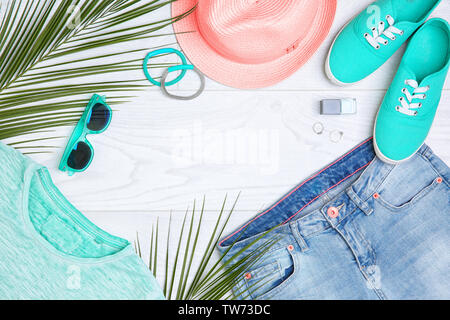 Composition with mint clothes and accessories on light background Stock Photo
