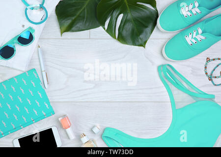 Composition with mint clothes and accessories on light background Stock Photo