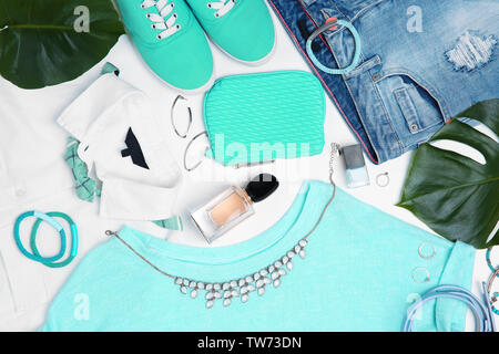 Composition with clothes and accessories on white background Stock Photo