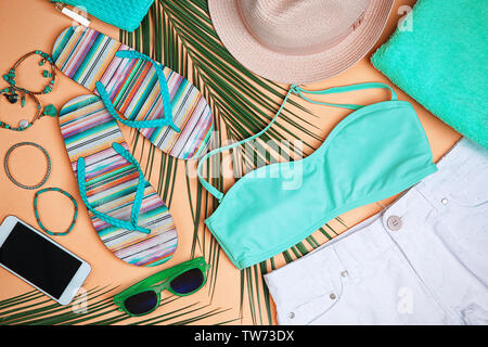 Composition with mint clothes and accessories on apricot background Stock Photo