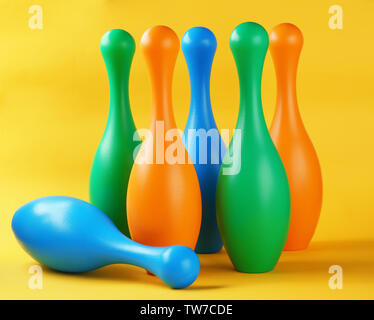 Bright bowling pins on color background Stock Photo