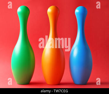 Bright bowling pins on color background Stock Photo