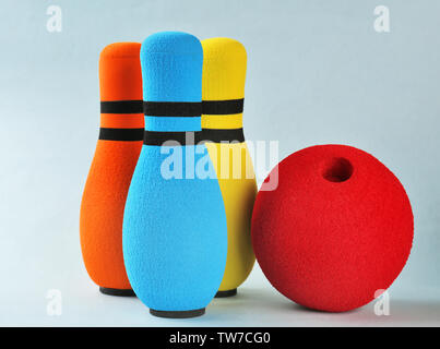 Bright bowling pins and ball on light background Stock Photo