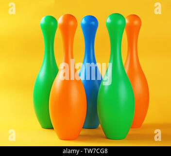 Bright bowling pins on color background Stock Photo