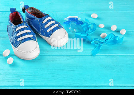 Baby's first shoes on table Stock Photo