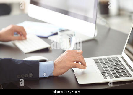 Manager working with laptop in office Stock Photo