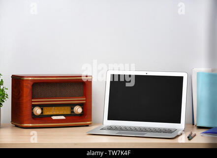 Retro radio on table in room Stock Photo