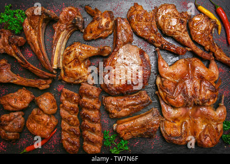 Different grilled meat on slate plate, top view Stock Photo
