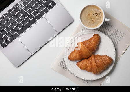 Composition with plate of delicious croissants on white background Stock Photo