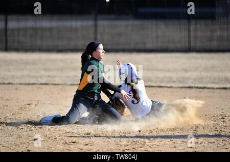 Runner being tagged out on an attempted steal of second. USA. Stock Photo