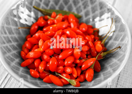 Fresh goji berries in bowl, closeup Stock Photo