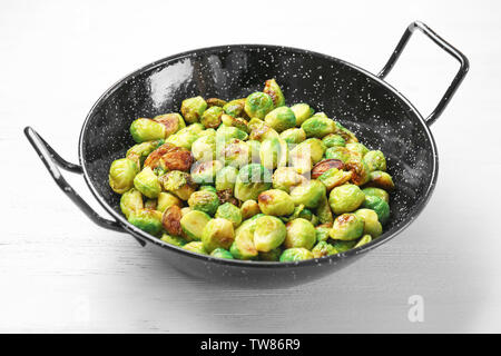 Frying pan with roasted brussel sprouts on table Stock Photo