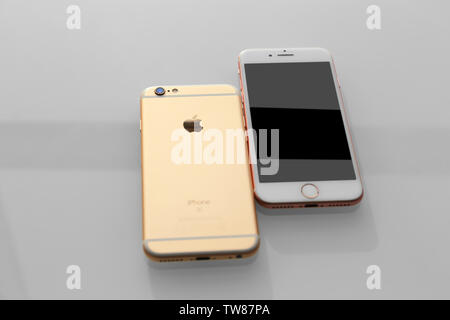 KIEV, UKRAINE - OCTOBER 19, 2017: Back panel of iPhone 7 Rose gold and iPhone 6s Gold on light background Stock Photo