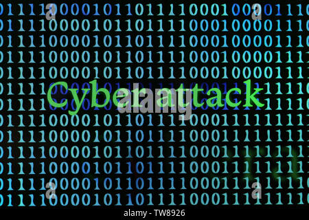 Words "Cyber attack" with binary code on screen Stock Photo