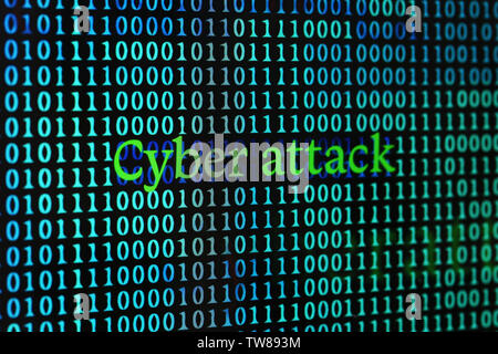 Words "Cyber attack" with binary code on screen Stock Photo