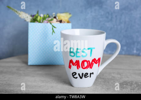 https://l450v.alamy.com/450v/tw8a3w/cup-with-text-best-mom-ever-for-mothers-day-on-table-tw8a3w.jpg