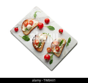 Board with delicious tomato and mozzarella sandwiches on white background Stock Photo