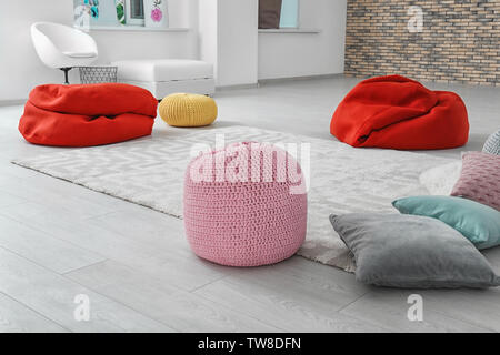Poufs in room prepared for group psychotherapy session Stock Photo