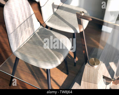 Transparent glass table and two chairs in a modern interior Stock Photo