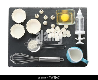 Kitchen utensils and ingredients for pastries on white background Stock Photo