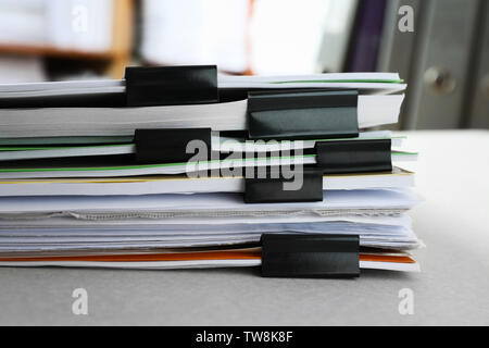 Stack of folders with documents on table in archive Stock Photo